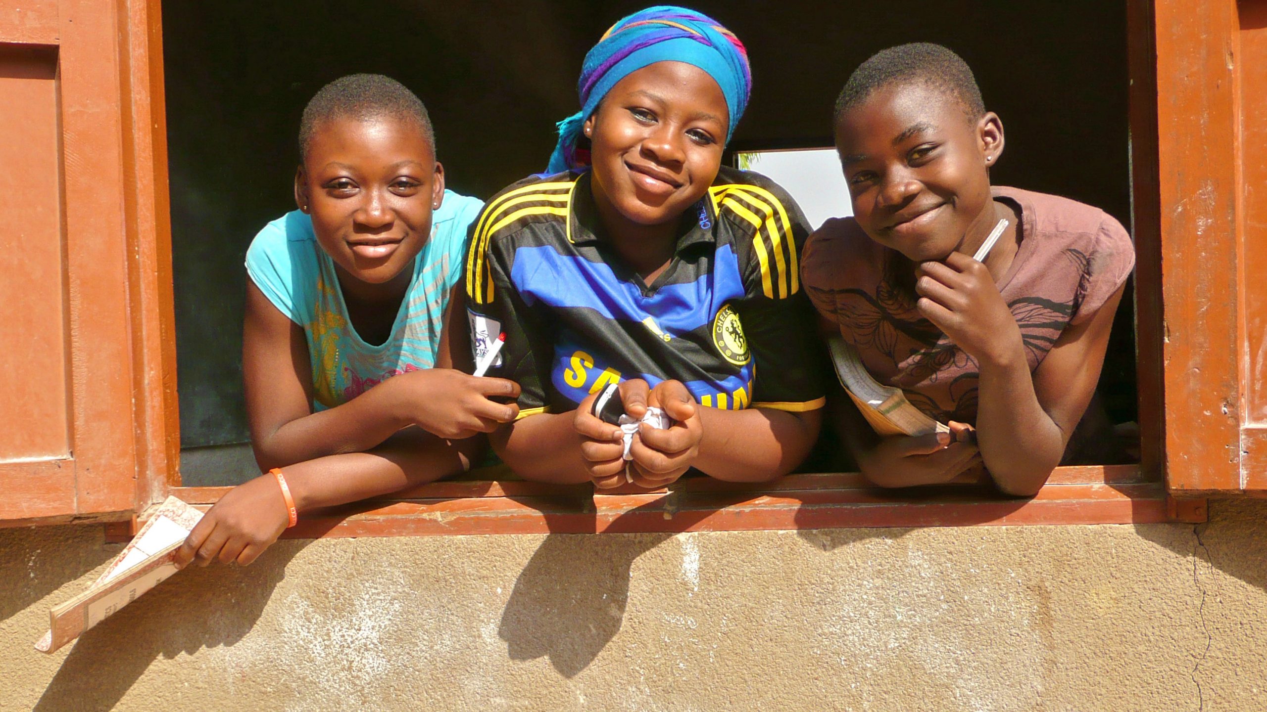 Our Impact Three schoolgirls in Ghana. Photo copyright Paula Stromberg.