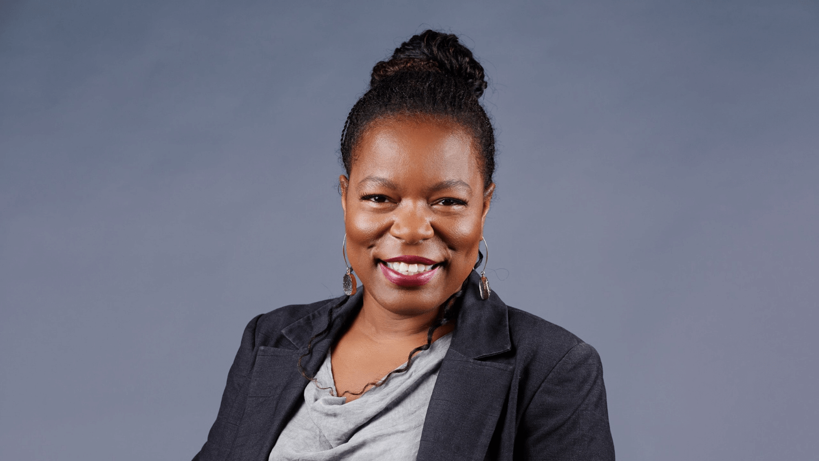 Latanya Mapp Frett turns to the camera and smiles. 