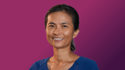 An cutout image of PeiYao Chen over a gradient purple background.