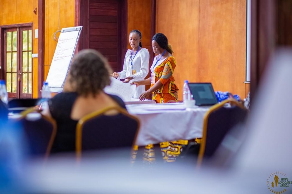 Aichatou and Prisca, Movement Committee members from Ivory Coast, present to the rest of the Movement Committee about the status of abortion laws and policy, access, and movement building in their country.