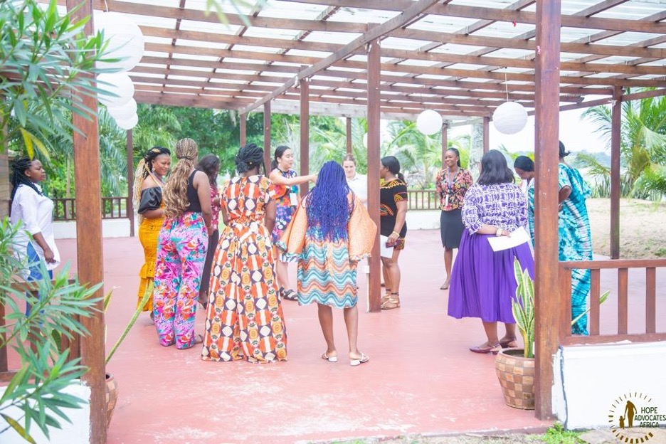 All eight members of the Movement Committee stand outside in a circle with Global Fund for Women team for a warm-up activity where we shared about what we’re learning in our own lives and why we enjoy the process, to inform the Movement Committee’s discussion about feminist learning and evaluation and defining success. 